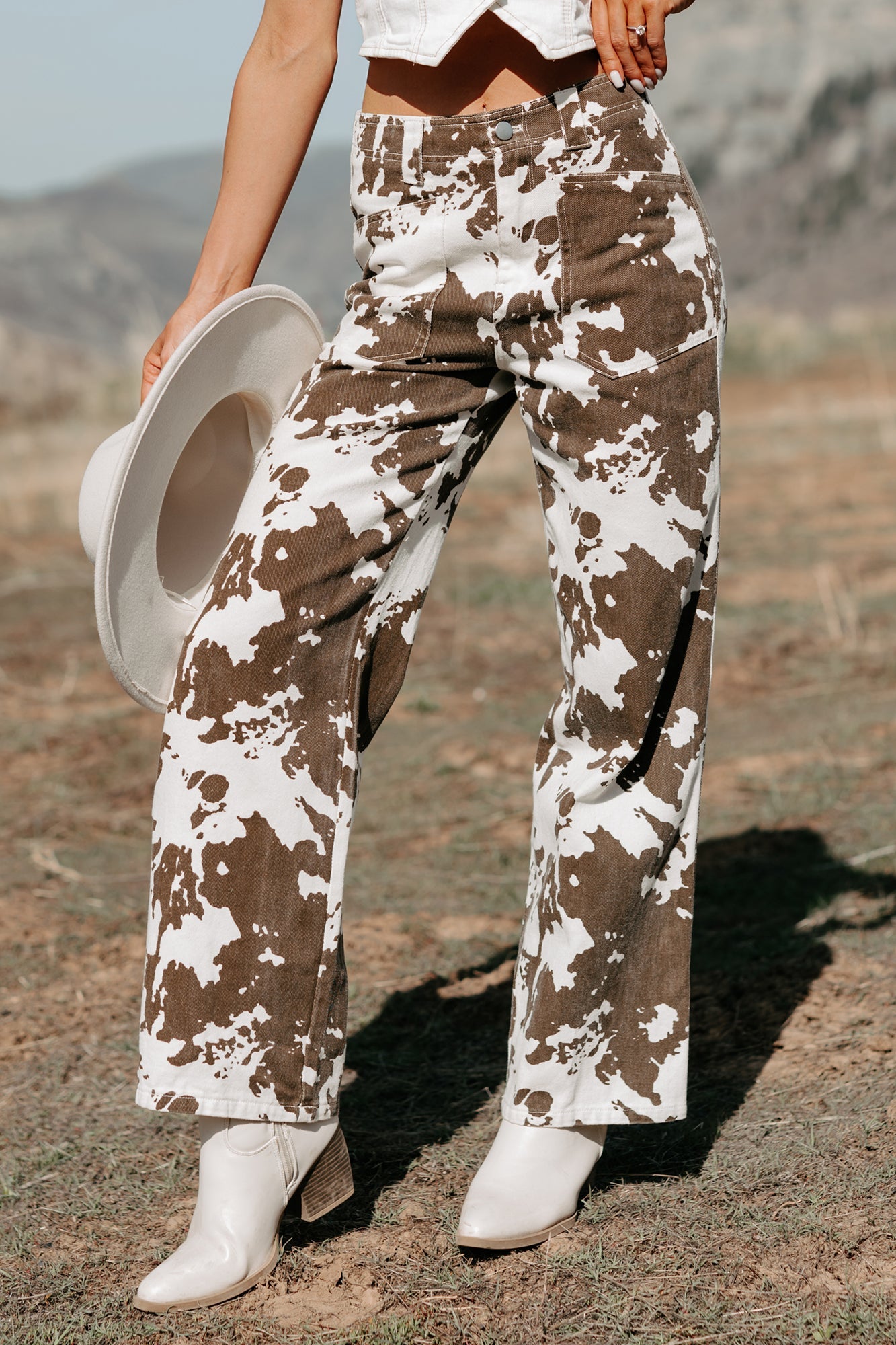 Cowboy Up Cow Print Pants (White/Brown)
